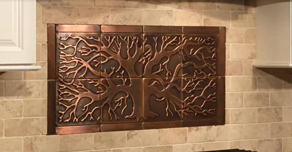 Black tree on stainless steel backsplash - Copper & Craft